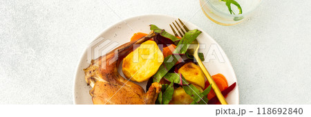 This gourmet dinner features succulent baked rabbit, golden roasted potatoes, and a fresh carrot salad, offering a nutritious, hearty, and savory option for a memorable meal, banner This gourmet dinner features succulent baked rabbit, golden roasted potatoes, and a fresh carrot salad, offering a nutritious, hearty, and savory option for a memorable meal, banner 118692840