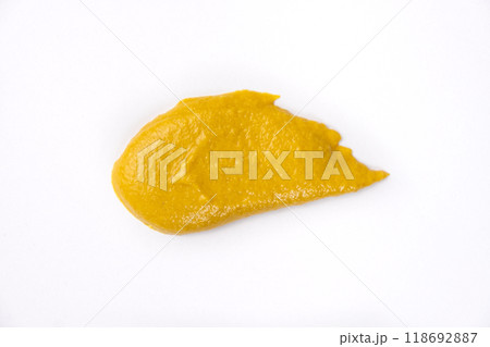 Smear of mustard sauce on white background isolate, creativity in cooking, macro texture Smear of mustard sauce on white background isolate, creativity in cooking, macro texture 118692887