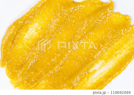 Smear of mustard sauce on white background isolate, creativity in cooking, macro texture 118692889