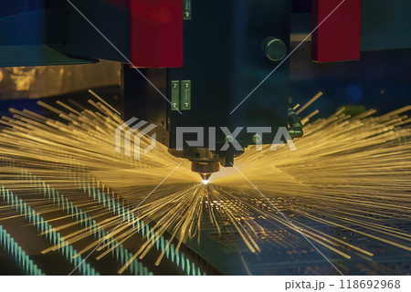 The fiber laser cutting machine cut the metal plate with the sparkling light. The fiber laser cutting machine cut the metal plate with the sparkling light. 118692968