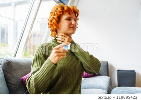 portrait of a young woman with a cold 118695422