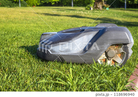 Lawn robot mows the lawn. Lawn robot mows the lawn. 118696940