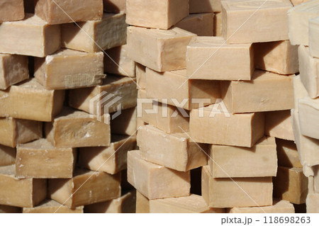 Stacks Handmade Natural Soap Bars forming a visually pleasing arrangement. Emphasize Organic Skincare Ecofriendly Wellness practices Sustainable Beauty Products solutions for a healthier lifestyle 118698263