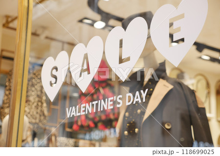 A message celebrating Valentines Day displayed on the glass door of a trendy fashion boutique A message celebrating Valentines Day displayed on the glass door of a trendy fashion boutique 118699025
