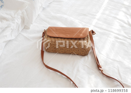 This is a stylish woven crossbody bag that features a beautiful leather flap design This is a stylish woven crossbody bag that features a beautiful leather flap design 118699358