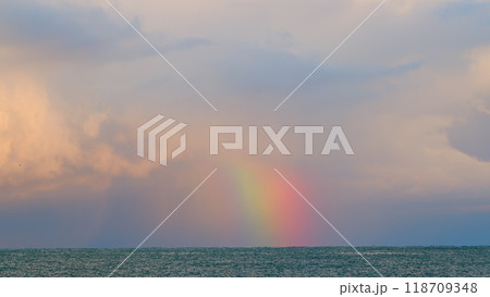 Beautiful Sea Landscape. Rainbow Under The Clouds Over Sea. Weather After Rain. Static view. 118709348