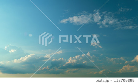 Clouds Sky On Evening Time. Yellow Colorful Or Romantic Golden Hour Sunlight. Nature Composition. Clouds Sky On Evening Time. Yellow Colorful Or Romantic Golden Hour Sunlight. Nature Composition. 118709899