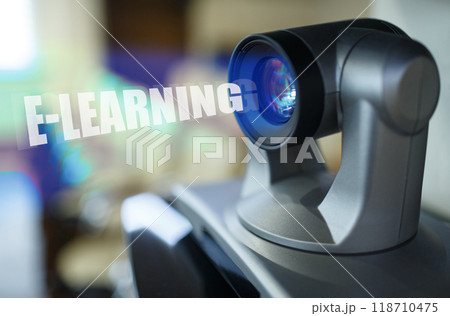 A blue beam glows from the projector inside which is the inscription - E-LEARNING A blue beam glows from the projector inside which is the inscription - E-LEARNING 118710475