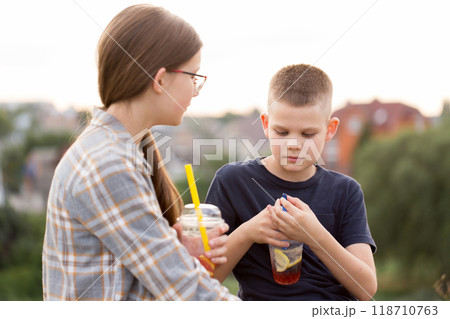 Children have chatting and drinking bubble tea Children have chatting and drinking bubble tea 118710763