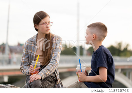 Children rest, communicate and drink bubble tea Children rest, communicate and drink bubble tea 118710768