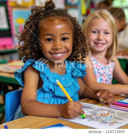 Two schoolgirls of different races paint at a creative art school 118711605
