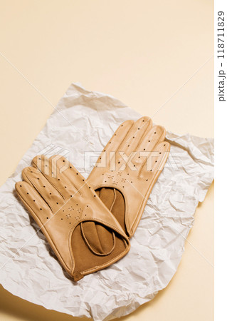 A pair of gloves on crumpled paper 118711829