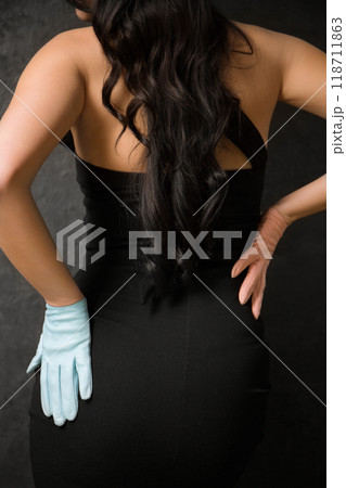 Multicolored blue and pink gloves on female hands Multicolored blue and pink gloves on female hands 118711863
