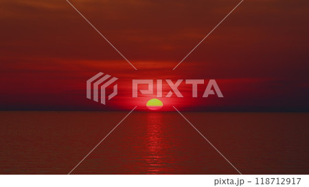 Fiery Sunsets Over Ocean. Bright Sunset With Sun Over Calm Sea Surface. 118712917
