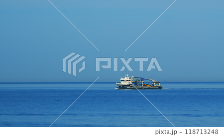 Fishing Ship In The Calm Sea. Fishing Boat Out In The Ocean Or Sea Wide. Still. 118713248