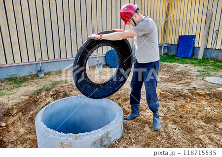 Installation of support ring for septic tank manhole cover made of concrete rings. 118715535