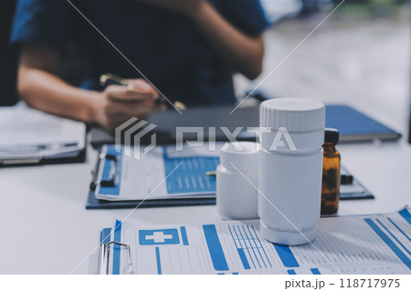 international team of professional doctors having a meeting in conference room at the modern hospital. Healthcare and medical development concept. international team of professional doctors having a meeting in conference room at the modern hospital. Healthcare and medical development concept. 118717975