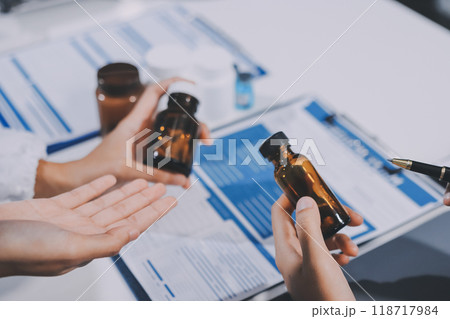 international team of professional doctors having a meeting in conference room at the modern hospital. Healthcare and medical development concept. international team of professional doctors having a meeting in conference room at the modern hospital. Healthcare and medical development concept. 118717984