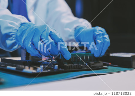 Electronics technician, electronic engineering electronic repair, electronics measuring and testing, repair and maintenance concepts. Electronics technician, electronic engineering electronic repair, electronics measuring and testing, repair and maintenance concepts. 118718022