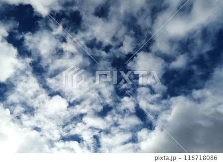 Dramatic Cloudy Sky with Bright Blue Background 118718086