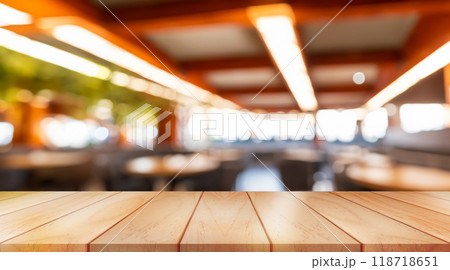 Empty wooden table top with lights bokeh on blur restaurant background Empty wooden table top with lights bokeh on blur restaurant background 118718651