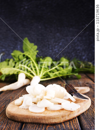 White radish on wooden board 118719636