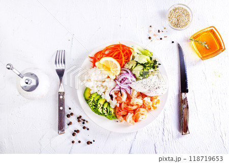 Lunch diet - rice, shrimp, avocado in one plate on a light background Lunch diet - rice, shrimp, avocado in one plate on a light background 118719653
