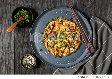 Japanese pancake with cabbage on a plate, top view 118721605