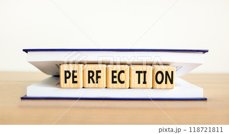 Perfection symbol. Concept word Perfection on beautiful wooden cubes in book. Beautiful wooden table white background. Business perfection concept. Copy space. 118721811