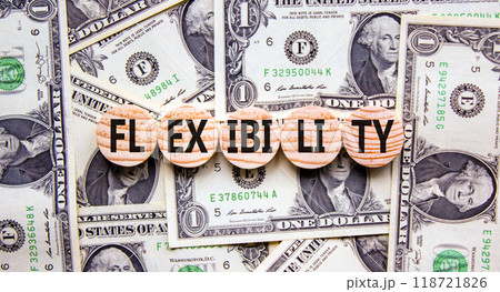 Flexibility symbol. Concept word Flexibility on beautiful wooden circles. Dollar bills. Beautiful background from dollar bills. Business flexibility concept. Copy space. 118721826