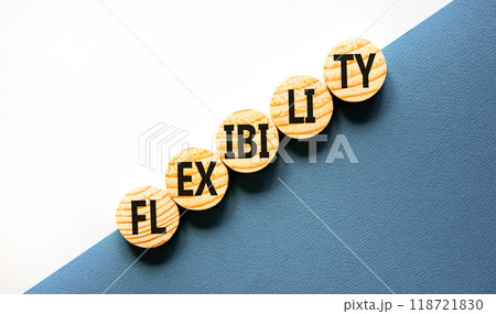 Flexibility symbol. Concept word Flexibility on beautiful wooden circles. Beautiful white and blue background. Business flexibility concept. Copy space. Flexibility symbol. Concept word Flexibility on beautiful wooden circles. Beautiful white and blue background. Business flexibility concept. Copy space. 118721830