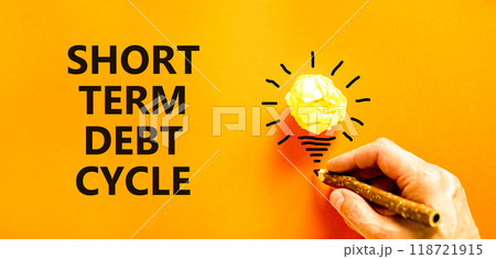 Short term debt cycle symbol. Concept words Short term debt cycle on beautiful orange paper. Beautiful orange background. Businessman hand. Business Short term debt cycle concept. Copy space 118721915