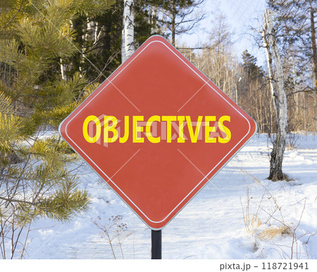 Objectives symbol. Concept word Objectives on beautiful red road sign. Beautiful winter snow forest background. Business objectives concept. Copy space. Objectives symbol. Concept word Objectives on beautiful red road sign. Beautiful winter snow forest background. Business objectives concept. Copy space. 118721941