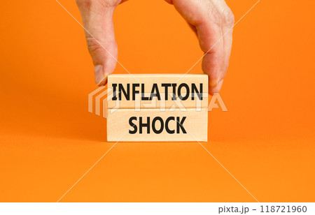 Inflation shock symbol. Concept words Inflation shock on wooden blocks. Beautiful orange table orange background. Businessman hand. Business inflation shock concept. Copy space. Inflation shock symbol. Concept words Inflation shock on wooden blocks. Beautiful orange table orange background. Businessman hand. Business inflation shock concept. Copy space. 118721960
