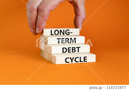 Long-term debt cycle symbol. Concept words Long-term debt cycle on beautiful wooden block. Beautiful orange table orange background. Businessman hand. Business Long-term debt cycle concept. Copy space Long-term debt cycle symbol. Concept words Long-term debt cycle on beautiful wooden block. Beautiful orange table orange background. Businessman hand. Business Long-term debt cycle concept. Copy space 118721977