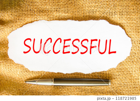 Successful symbol. Concept word Successful on beautiful white paper. Beautiful canvas background. Beautiful black pen. Business successful concept. Copy space. Successful symbol. Concept word Successful on beautiful white paper. Beautiful canvas background. Beautiful black pen. Business successful concept. Copy space. 118721985