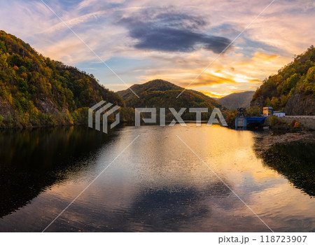 autumn landscape with lake in mountains. romania, europe. scenery in fall colors reflecting in the calm water at dusk 118723907