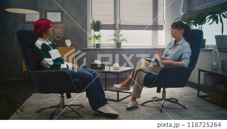 Teenage girl shares emotions during consultation with psychologist Teenage girl shares emotions during consultation with psychologist 118725264