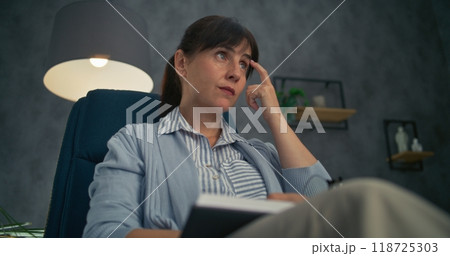 Close up of professional therapist listening to patient, taking notes 118725303