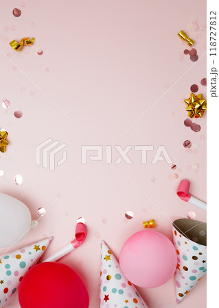 Birthday attributes colorful balloons, party hats and confetti. Concept of festive birthday celebrations Birthday attributes colorful balloons, party hats and confetti. Concept of festive birthday celebrations 118727812
