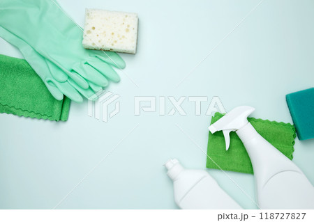 Cleaning supplies and tools, including bottles, gloves, sponges, and cloths. Concept of cleanliness and hygiene Cleaning supplies and tools, including bottles, gloves, sponges, and cloths. Concept of cleanliness and hygiene 118727827
