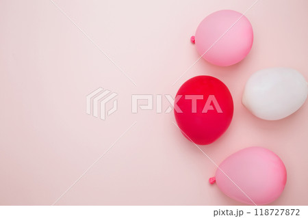 Birthday attributes colorful balloons. Concept of festive birthday celebrations 118727872