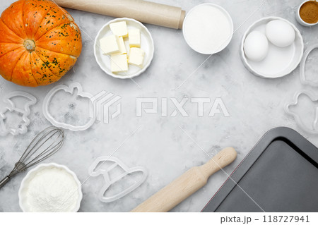 Ingredients for baking Halloween cookies including flour, butter, sugar, spices, eggs and pumpkin. Seasonal autumn baking Ingredients for baking Halloween cookies including flour, butter, sugar, spices, eggs and pumpkin. Seasonal autumn baking 118727941