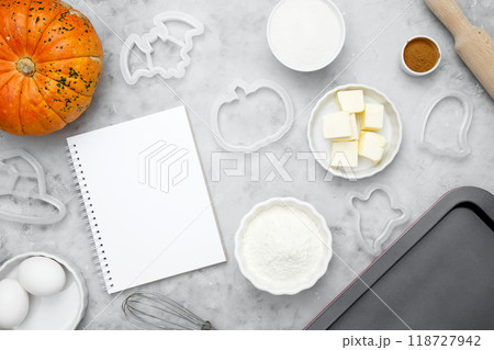 Ingredients for baking cookies for Halloween, notepad mock-up for writing down the recipe. Seasonal autumn baking Ingredients for baking cookies for Halloween, notepad mock-up for writing down the recipe. Seasonal autumn baking 118727942