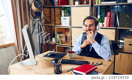 Nervously biting his nails, this businessman seems to be contemplating important decision or how to navigate difficult work problem. 118729559