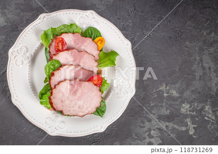 meat sausages slices with salad on a dark background. top view. copy space for text 118731269