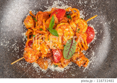 Pasta spicy tomato sauce with shrimp. Food recipe background. Close up. top view Pasta spicy tomato sauce with shrimp. Food recipe background. Close up. top view 118731481