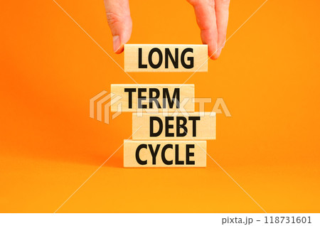 Long term debt cycle symbol. Concept words Long term debt cycle on beautiful wooden block. Beautiful orange table orange background. Businessman hand. Business Long term debt cycle concept. Copy space Long term debt cycle symbol. Concept words Long term debt cycle on beautiful wooden block. Beautiful orange table orange background. Businessman hand. Business Long term debt cycle concept. Copy space 118731601