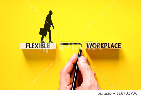 Flexible workplace symbol. Concept words Flexible workplace on beautiful block. Businessman icon. Businessman hand. Beautiful yellow background. Business Flexible workplace concept. Copy space. 118731730