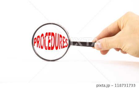 Procedures symbol. Concept word Procedures in beautiful magnifying glass. Beautiful white paper background. Businessman hand. Business procedures concept. Copy space. Procedures symbol. Concept word Procedures in beautiful magnifying glass. Beautiful white paper background. Businessman hand. Business procedures concept. Copy space. 118731733